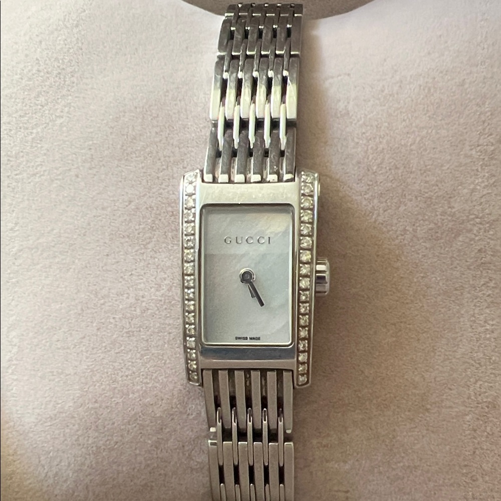 Gucci 8600 Series watch with mother of pearl face and diamonds